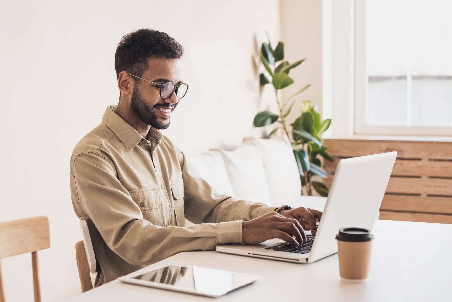 Men working at home. Freelancer businessman using laptop Freelancing Sites in India with Digi Uprise